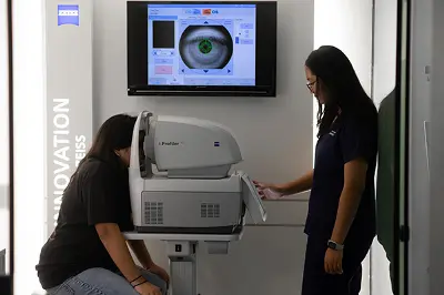 Optometry student conducting a digital refraction